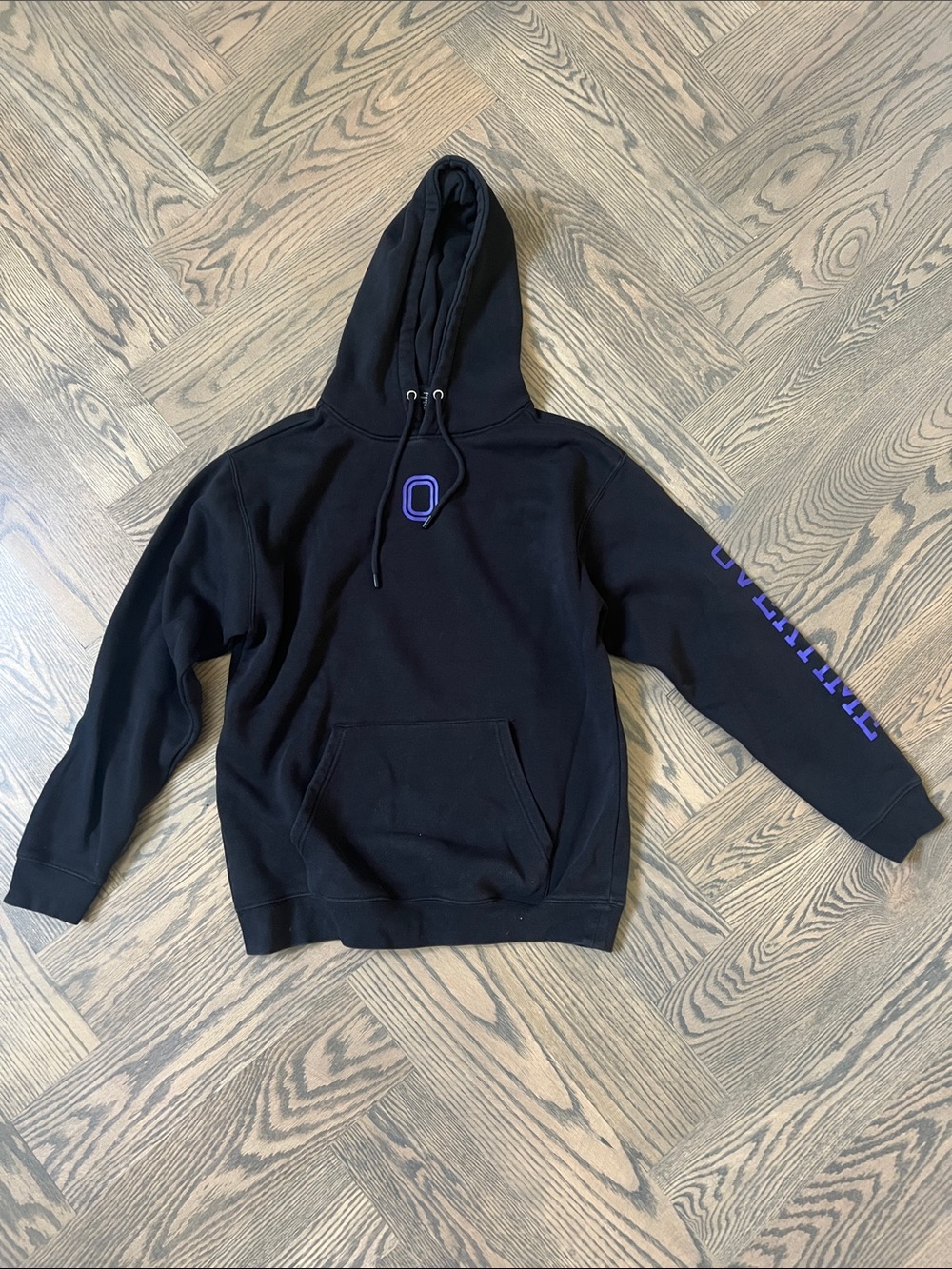 Overtime- Black Hoodie with Purple 'O' Accent